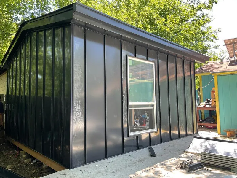 Black standing seam metal wall panels for Roof Inspection in McGregor